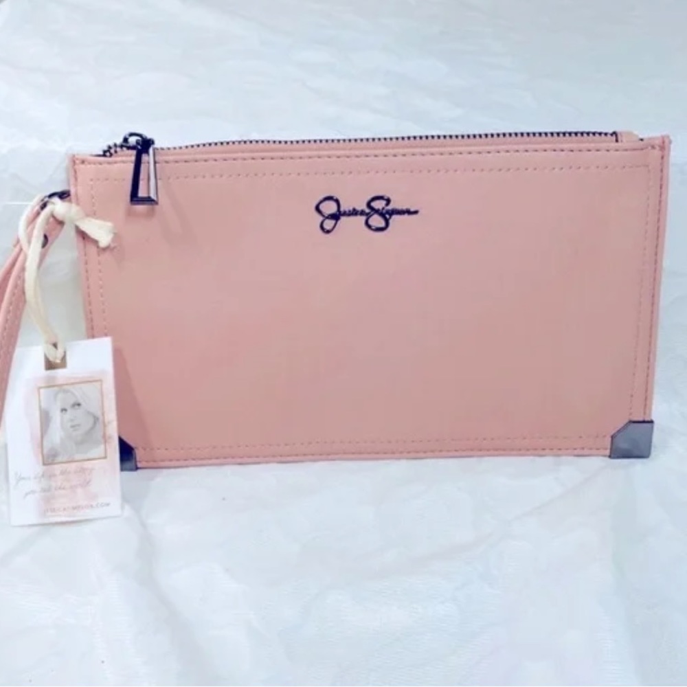 Jessica Simpson clutch pink in color can holds lip balm,cellphone,keys,and etc